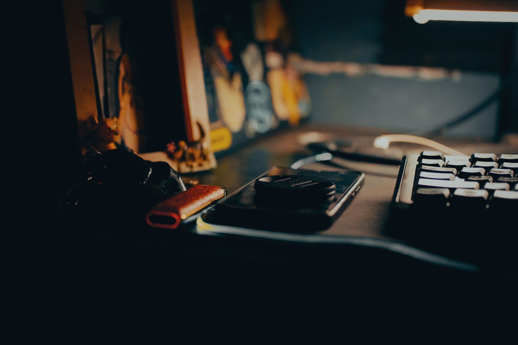 A dark studio workspace lit by a glowing screen